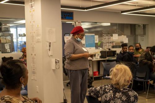 Member reads her poetry for the group